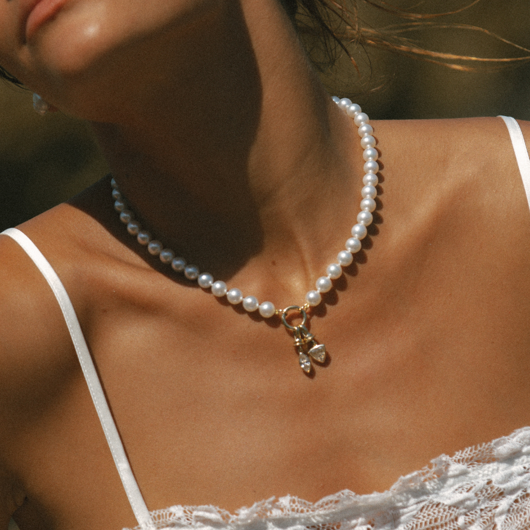South Sea Pearl necklace with a yellow gold round clasp worn by a model