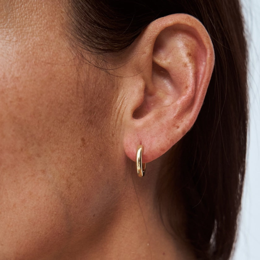 Form Huggies worn on model – 9k gold huggie earrings, Autore Moda