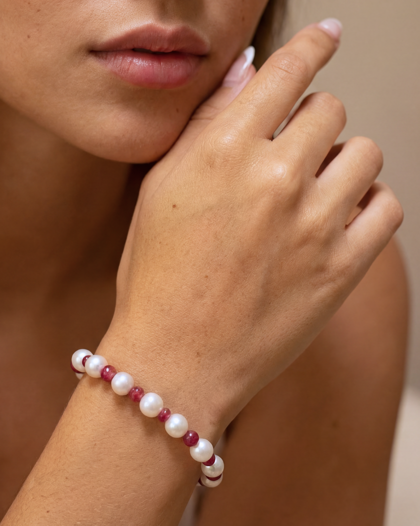 South Sea Pearl and red spinel bracelet with 9k yellow gold clasp on a models hand