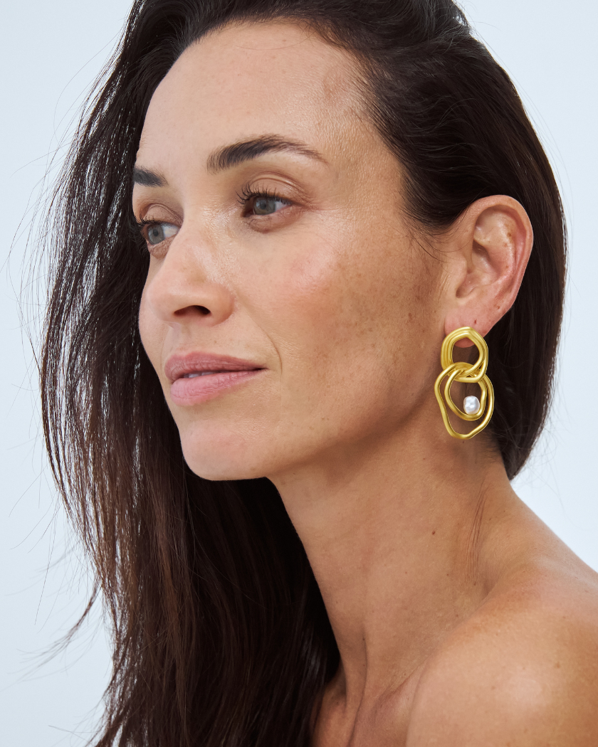 Celeste Statement Earrings with south sea keshi pearl in 18k yellow gold vermeil on model.