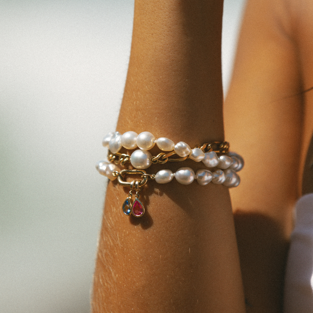 Handmade South Sea Keshi pearl bracelets with 9k gold clasp and Pink and Blue Sapphire charms.