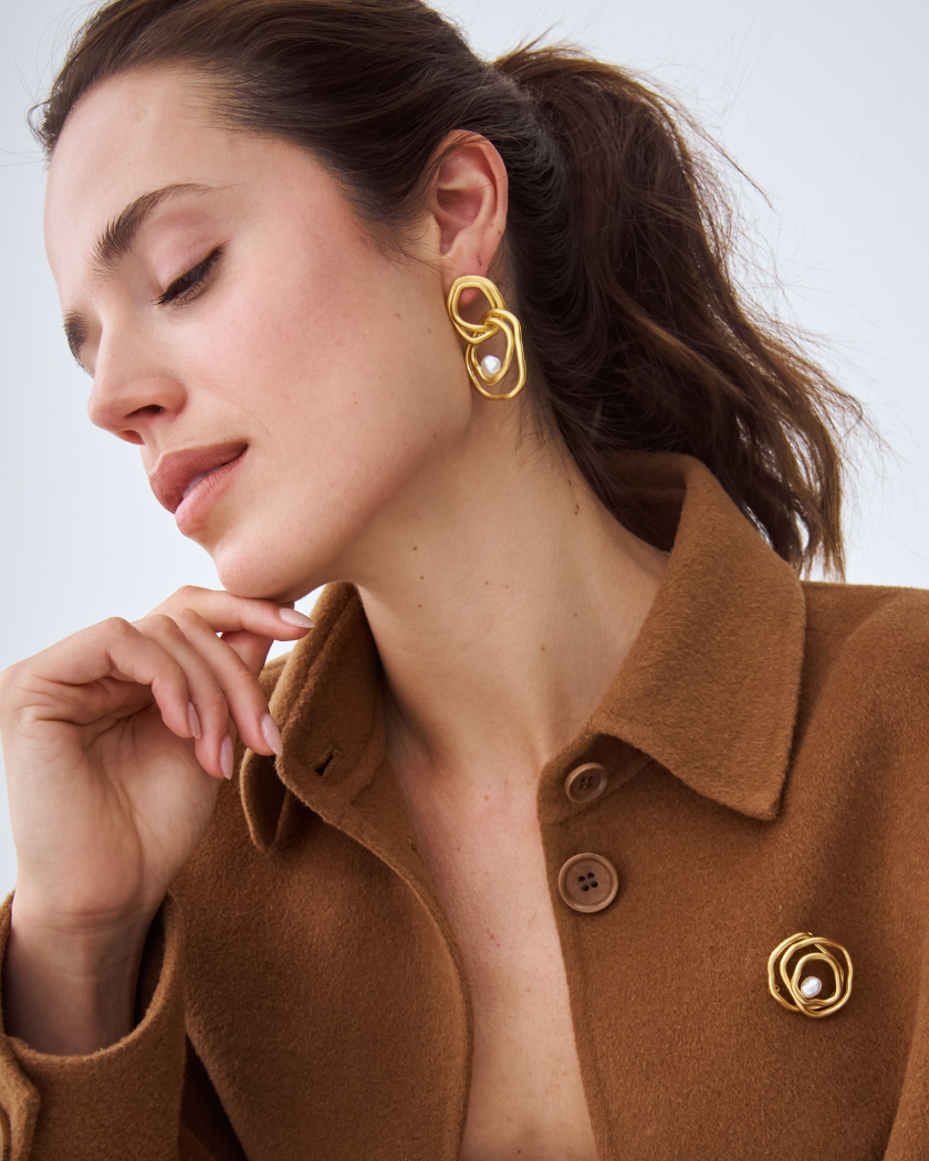 Celeste Statement Earrings and Brooch with south sea keshi pearl in 18k yellow gold vermeil on model.