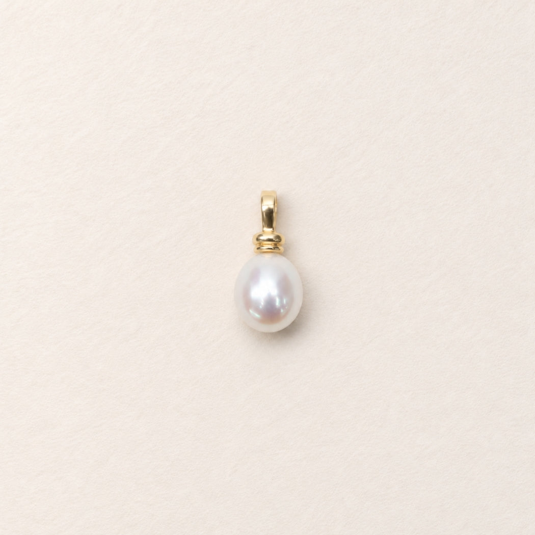 11mm south sea pearl charm on beige background