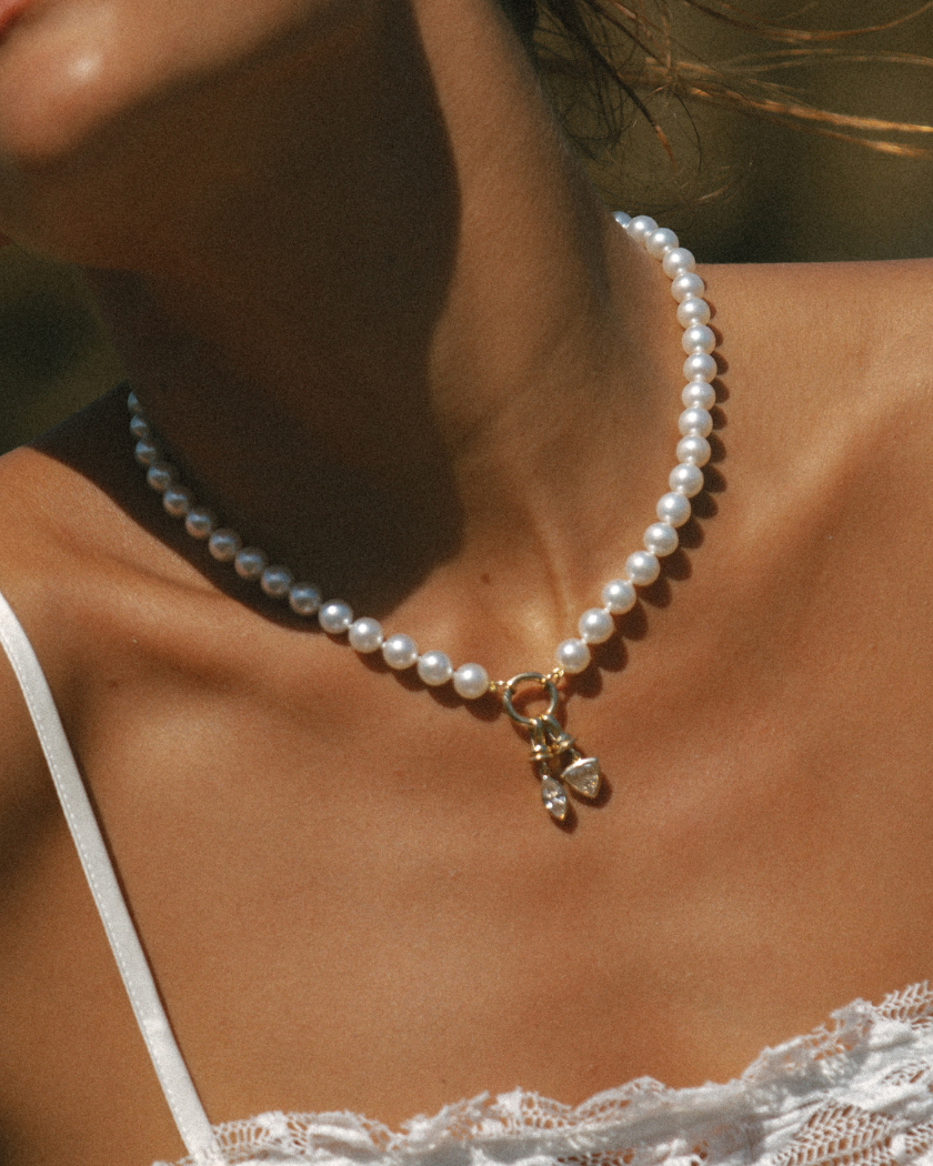 South Sea Pearl necklace with a yellow gold round clasp worn by a model 