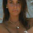 Close-up of 9k solid gold 3.34mm Italian chain with South Sea pearl and Amethyst charms.