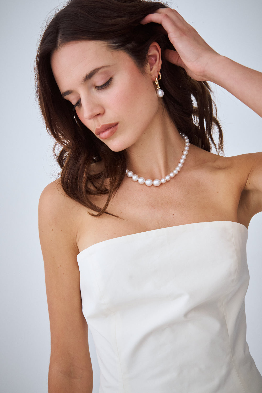 Bride wearing an AUTORE MODA South Sea pearl necklace and matching pearl drop earring