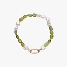 Handcrafted bracelet of Keshi South Sea pearls and Peridot gemstones with  9kt gold hinged clasp designed for personalising with your own charms.