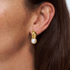 18k yellow gold vemeil melanie knot earrings on model 