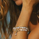 Handmade South Sea Keshi pearl bracelets with 9k clasp and bezel-set cushion cut champagne diamond charm.