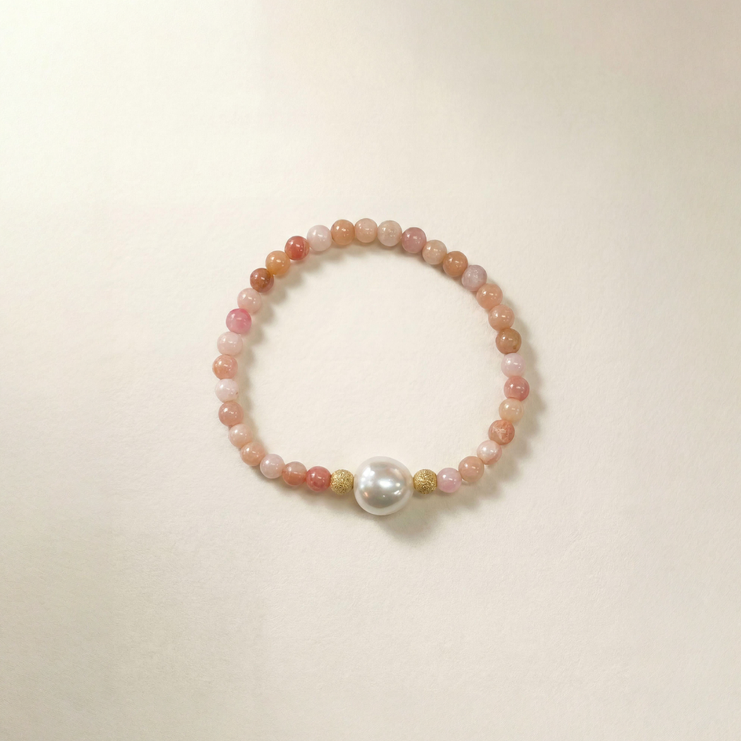 pink opal Beaded bracelet with a pearl on a beige background