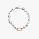 Handmade South Sea Keshi pearl bracelet with 9k solid gold clasp for adding charms.