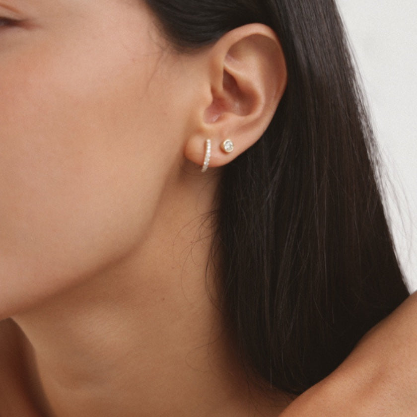 9k Solid Gold Bezel Studs worn on model – white diamond stud earrings, Autore Moda