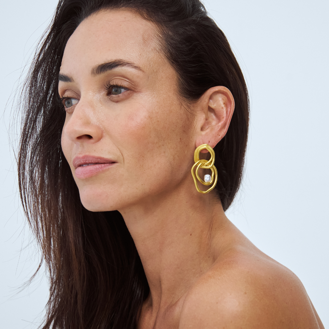 Celeste Statement Earrings with south sea keshi pearl in 18k yellow gold vermeil on model. 