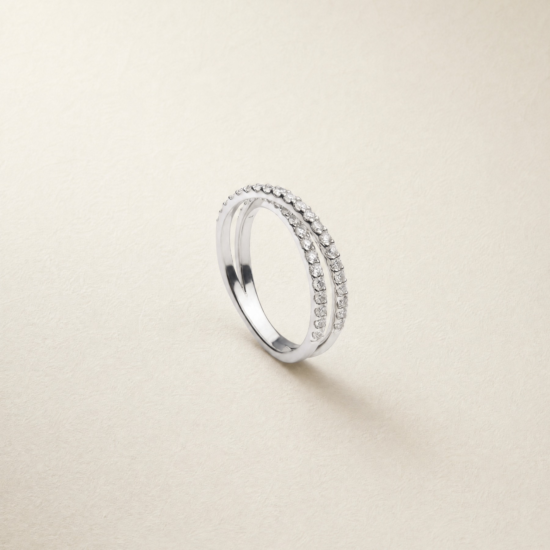 white diamond crossover ring set in 9k solid white gold 
