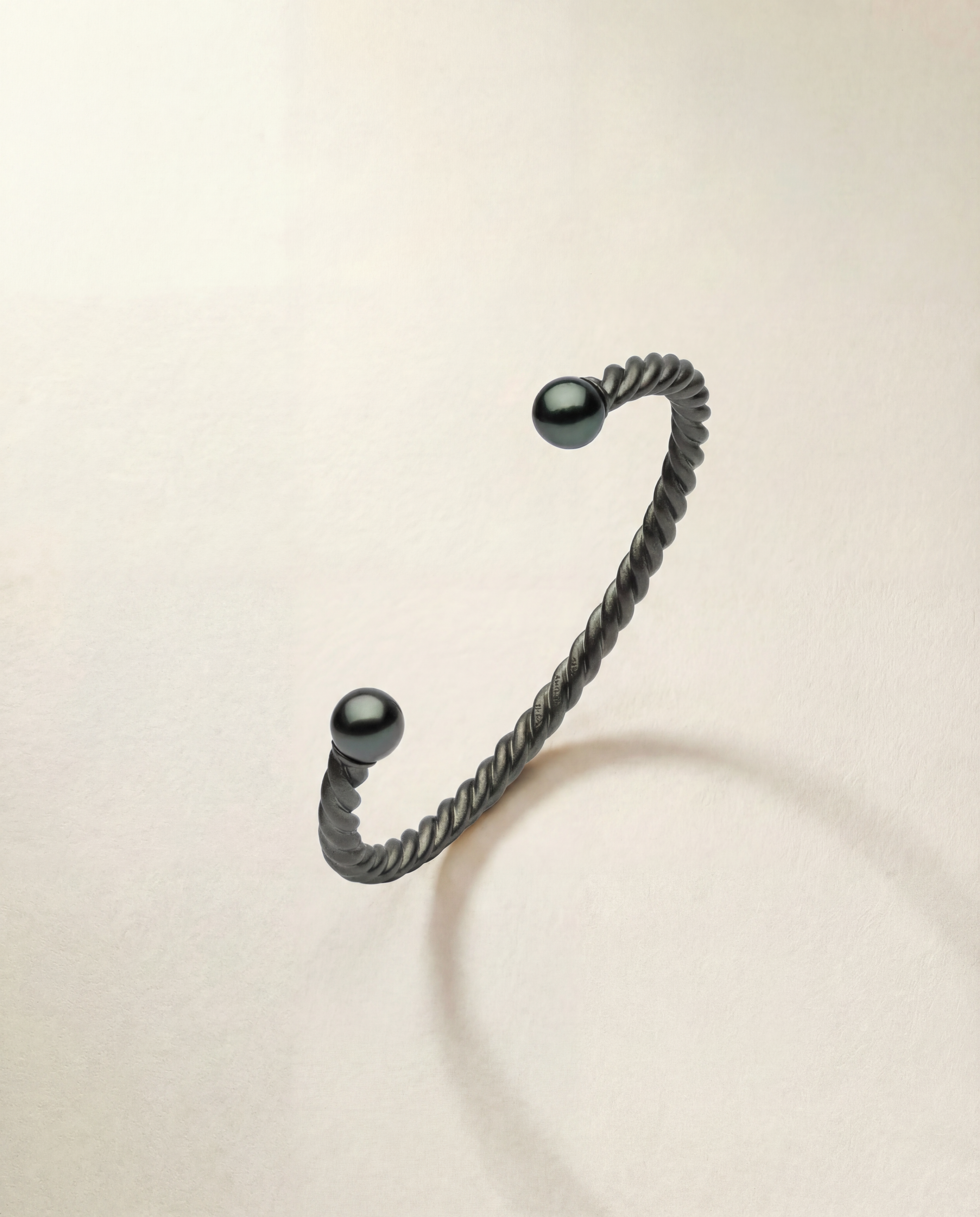 black mens cuff with black pearls