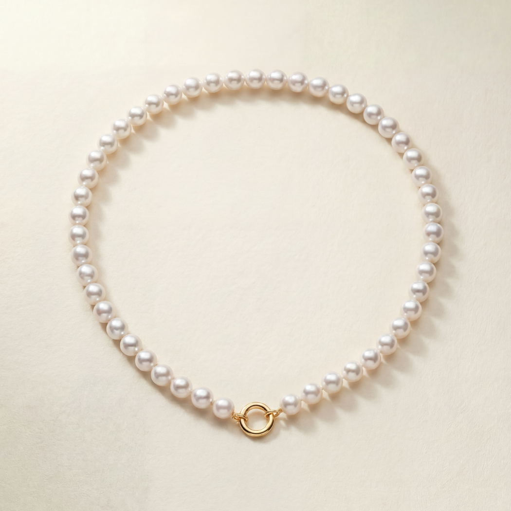 South Sea Round Pearl Strand on beige background